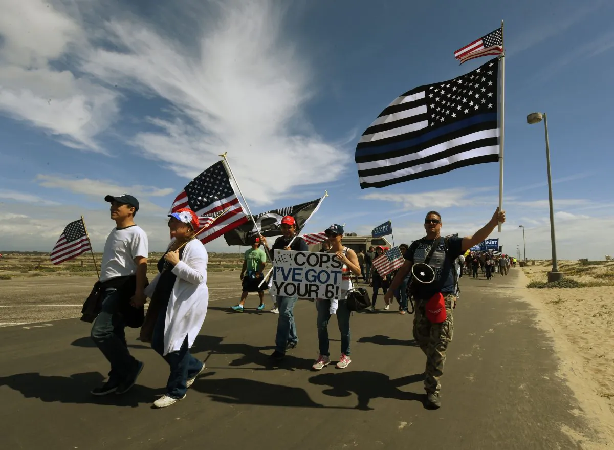 Supporters of US President Trump march during the "Make America Great Again" rally in Huntington Beach, California on March 25, 2017. (Mark Ralston/AFP/Getty Images)