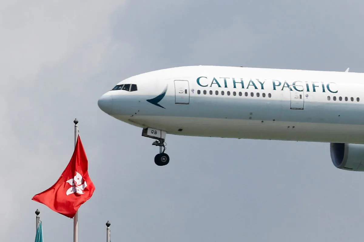A Cathay Pacific Boeing 777-300ER plane lands at Hong Kong airport after it reopened following clashes between police and protesters, in Hong Kong, China, on Aug. 14, 2019. (Thomas Peter/Reuters)