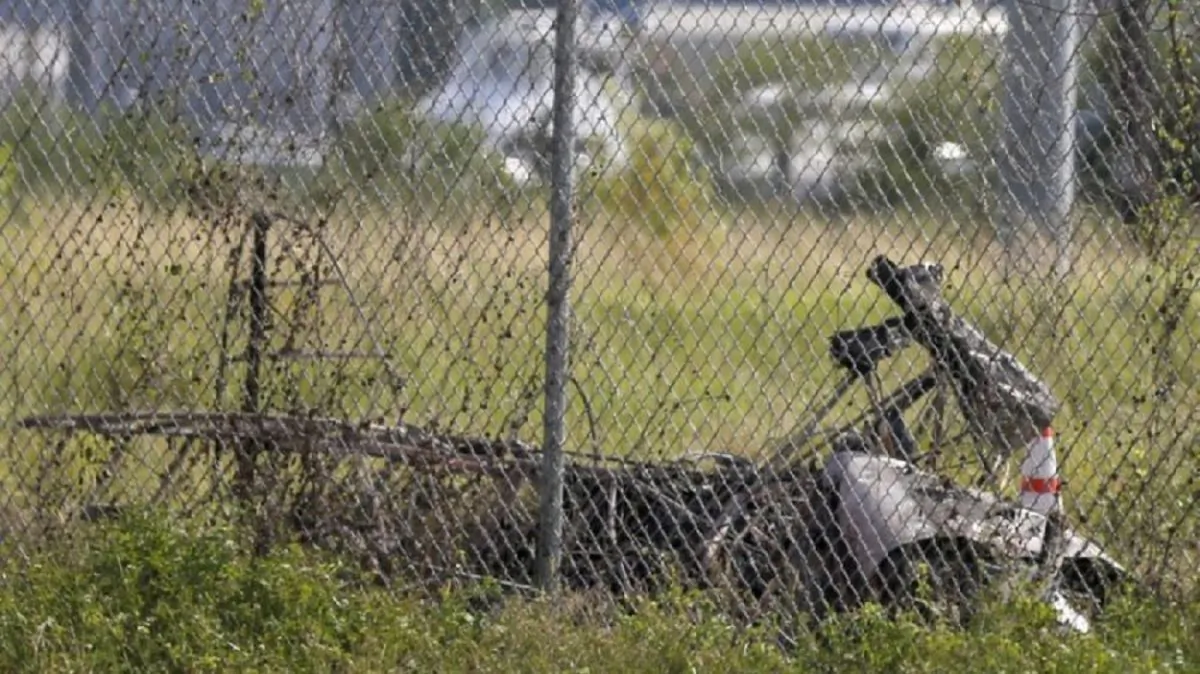 The charred wreckage of a private plane is seen in a field near the Industrial Canal and New Orleans Lakefront airport, in New Orleans on Aug. 16, 2019. (Gerald Herbert/AP Photo)