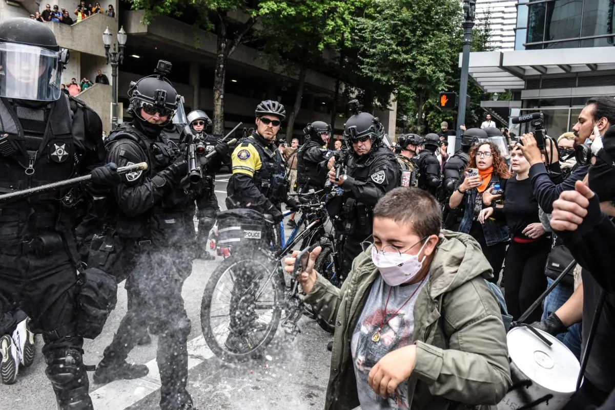 Portland police fire pepper spray rounds into a crowd of protesters during a rally in Portland, Oregon on Aug. 17, 2019. (Stephanie Keith/Getty Images)