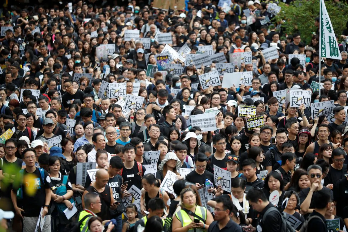 Teachers protest against the extradition bill during a rally organized by Hong Kong Professional Teachers' Union in Hong Kong, on Aug. 17, 2019. (Kim Hong-Ji/Reuters)