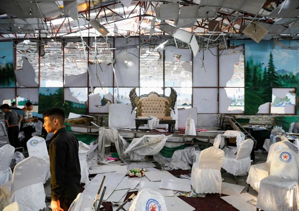 Workers of a wedding hall inspect after a blast in Kabul, Afghanistan, on Aug. 18, 2019. (REUTERS/Mohammad Ismail)