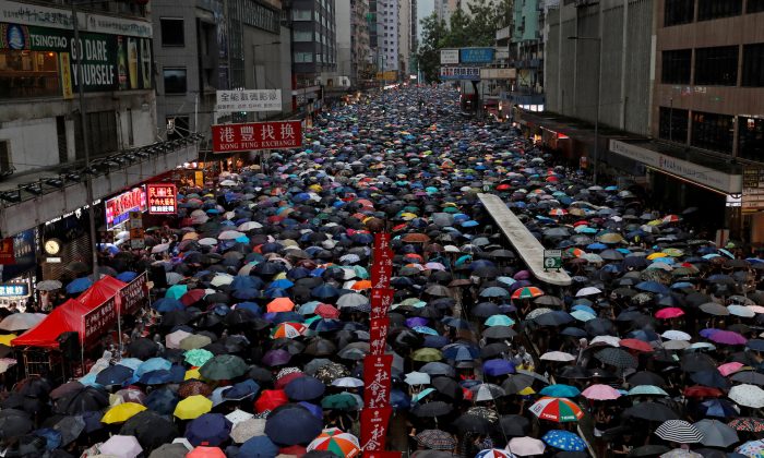 Anti-extradition bill protesters march to demand democracy and political reforms in Hong Kong, on Aug. 18, 2019. (Tyrone Siu/Reuters)