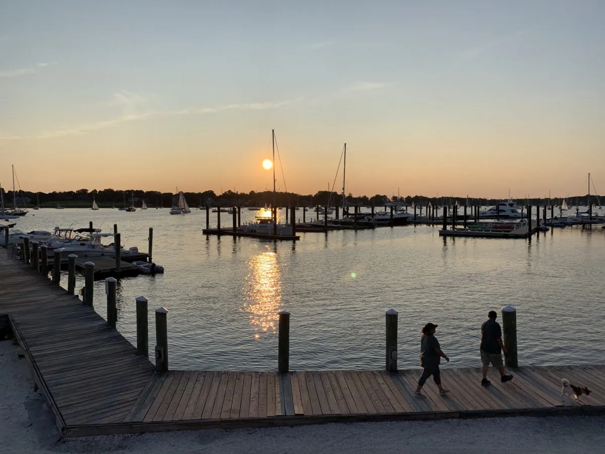 A view of the sunset, overlooking Bristol Harbor, from the outdoor upstairs patio of DeWolf Tavern. (Skye Sherman)