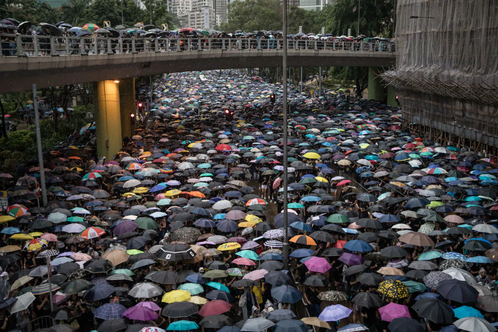 Hundreds of thousands of protesters march on a street after leaving a rally in Victoria Park in Hong Kong on Aug. 18, 2019. (Chris McGrath/Getty Images)