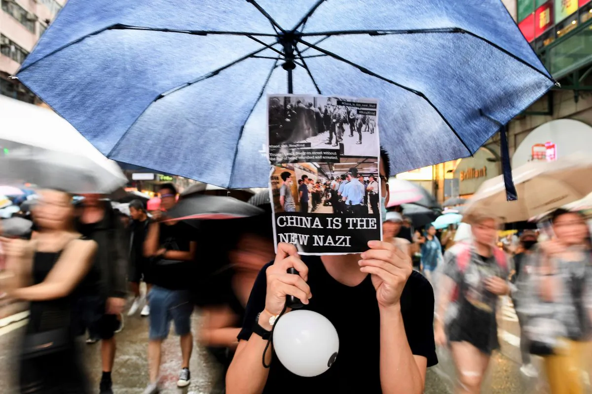 Protesters march during a rally in Hong Kong on Aug. 18, 2019, in the latest opposition to a planned extradition law that has transformed into a wider call for democratic rights. (Manan Vatsyana/AFP/Getty Images)