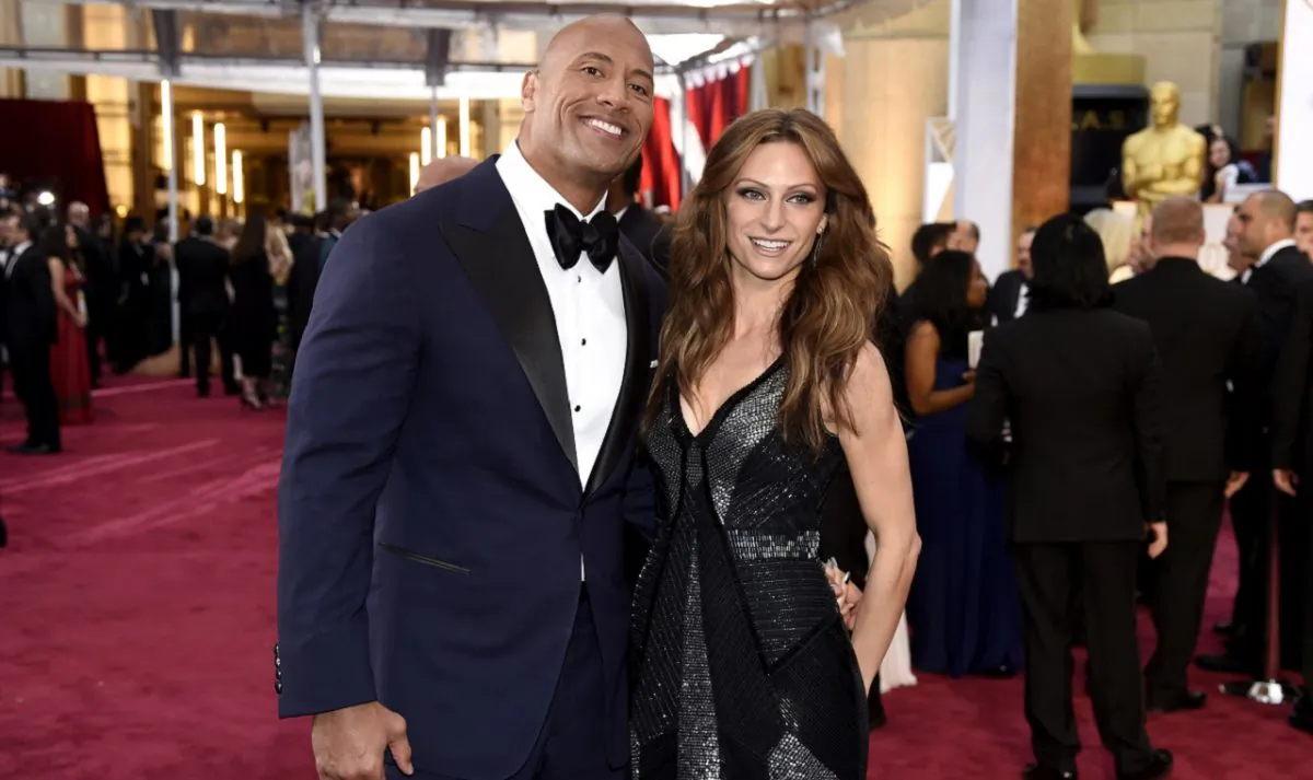 Dwayne Johnson (L) and Lauren Hashian arrive at the Oscars at the Dolby Theatre in Los Angeles on Feb. 22, 2015. (Chris Pizzello/Invision/AP)