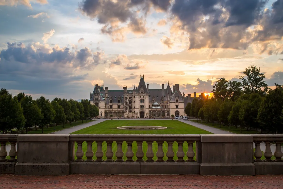 A view of the sunrise behind the Biltmore Estate. (Jared Kay/ExploreAsheville.com)