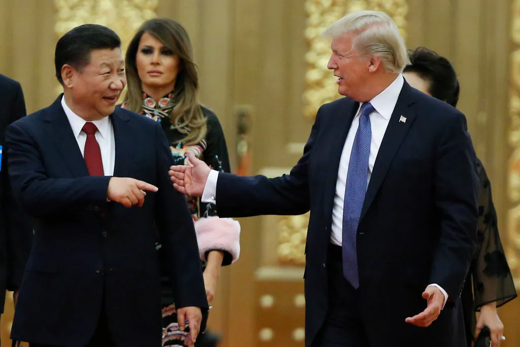 U.S. President Donald Trump and Chinese leader Xi Jinping arrive at a state dinner at the Great Hall of the People in Beijing on Nov. 9, 2017. (Thomas Peter-Pool/Getty Images)