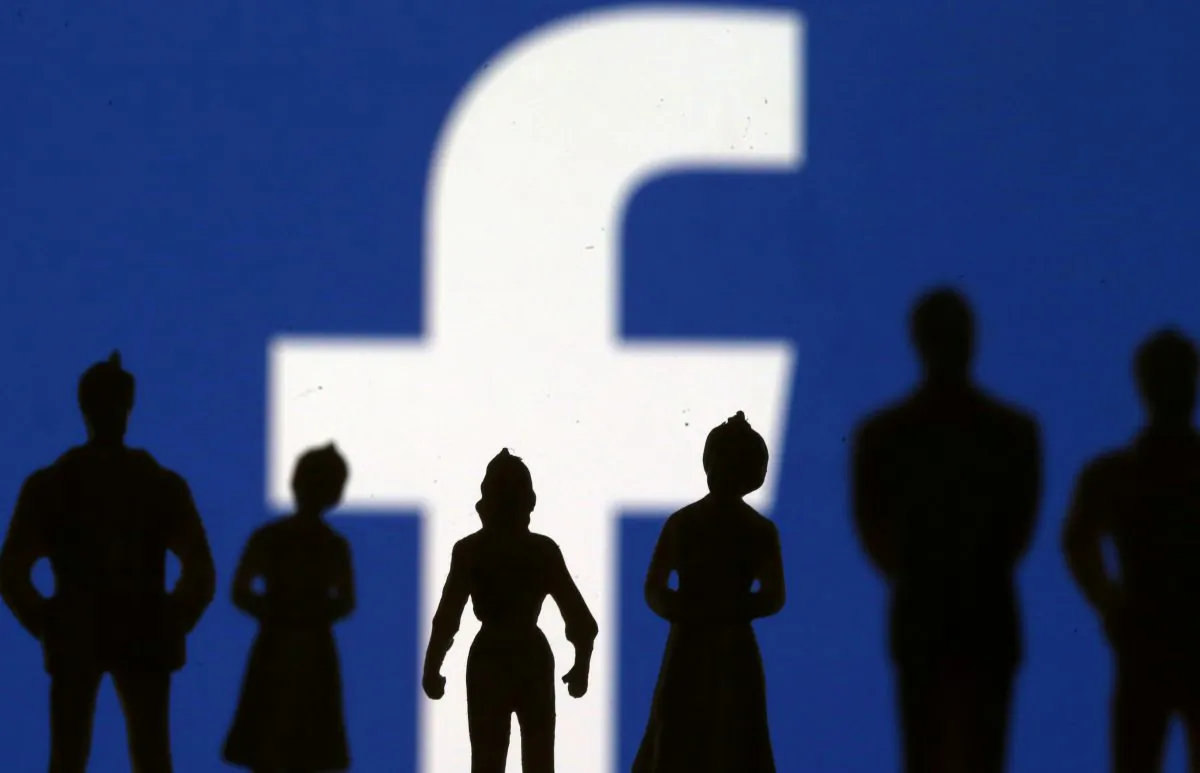 Small toy figures are seen in front of Facebook logo in this illustration picture, April 8, 2019. (Dado Ruvic/Illustration/Reuters)