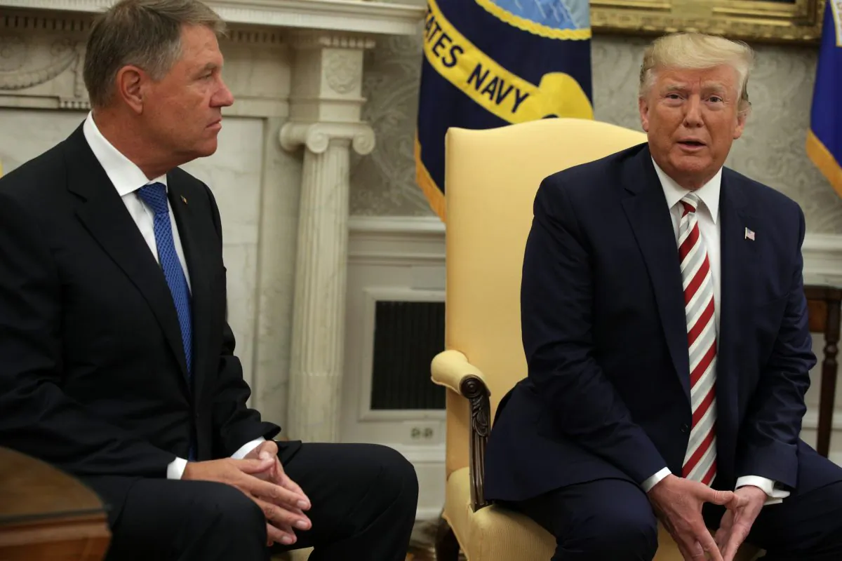 President Donald Trump speaks to members of the media as President of Romania Klaus Iohannis listens in the Oval Office of the White House in Washington on Aug. 20, 2019. (Alex Wong/Getty Images)
