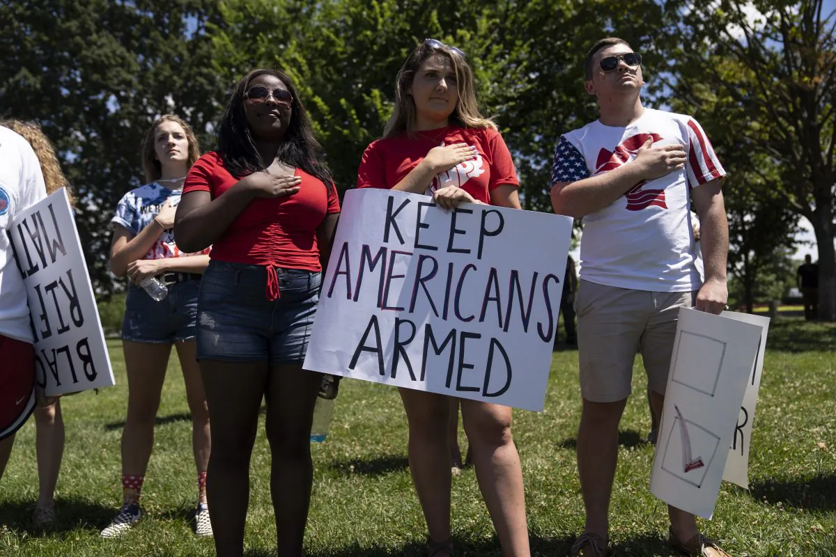 File photo showing people singing the national anthem during a rally promoting Second Amendment rights, in Washington, D.C., on July 7, 2018. (Toya Sarno Jordan/Getty Images)