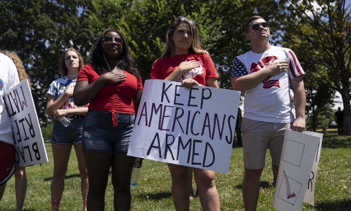 File photo showing people singing the national anthem during a rally promoting Second Amendment rights, in Washington, D.C., on July 7, 2018. (Toya Sarno Jordan/Getty Images)