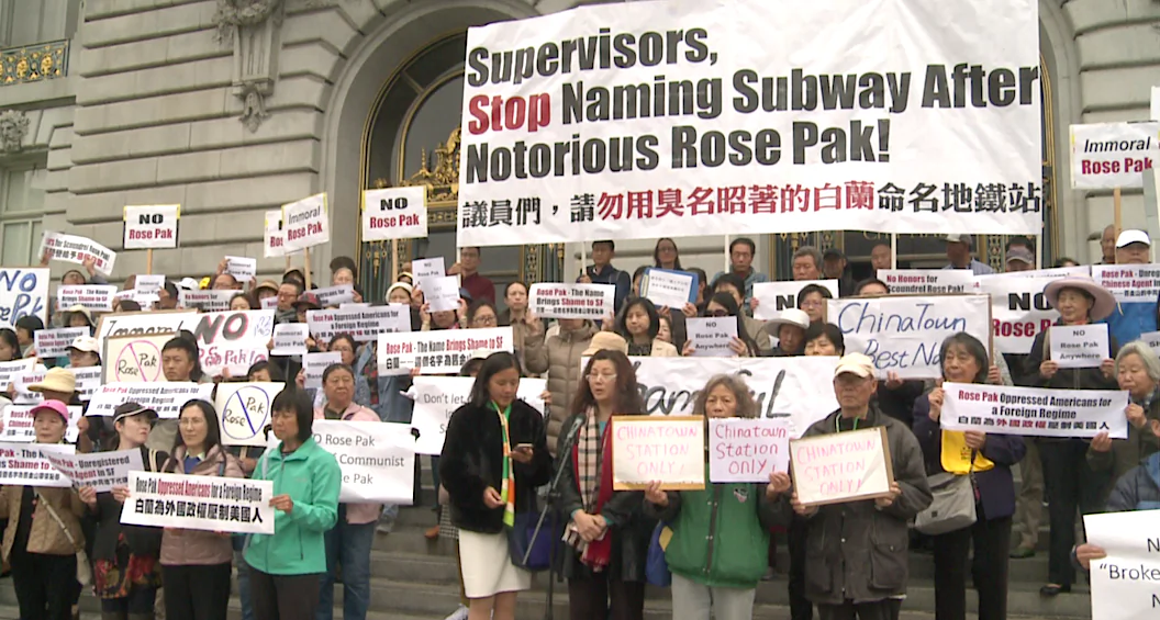 Rally participants holding signs on the steps outside San Francisco City Hall on May 6, 2019. (Nan Su/The Epoch Times)