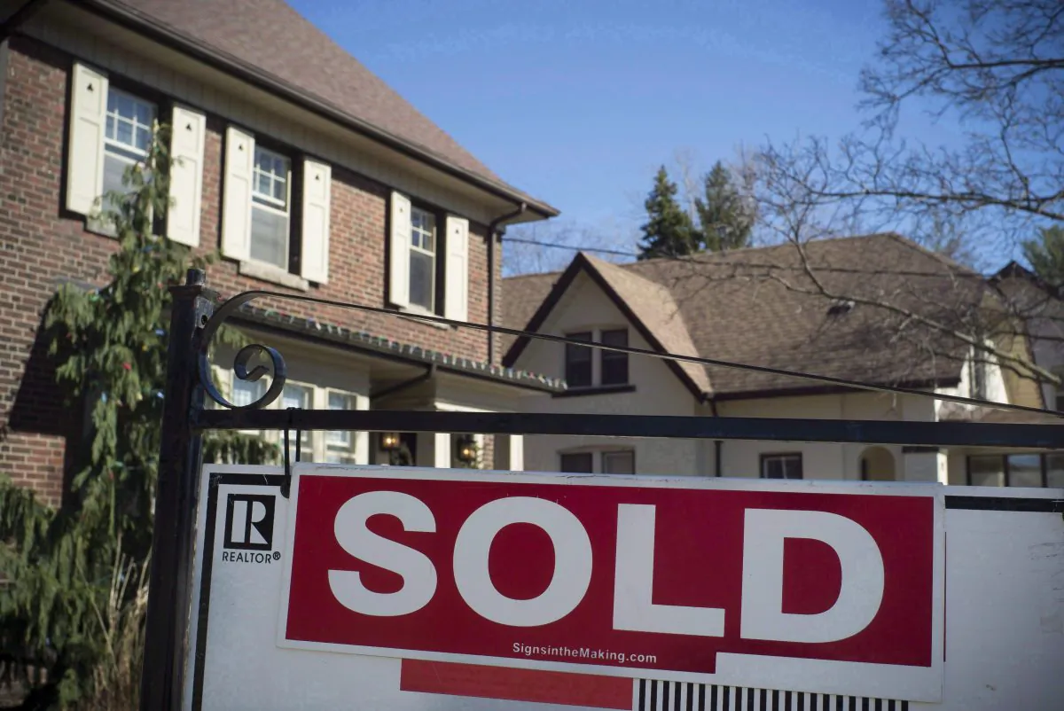 A sold sign in front of a west-end Toronto home in a file photo. Toronto homebuyers appear to be powering the national housing market while benefitting from lower mortgage rates. (The Canadian Press/Graeme Roy)
