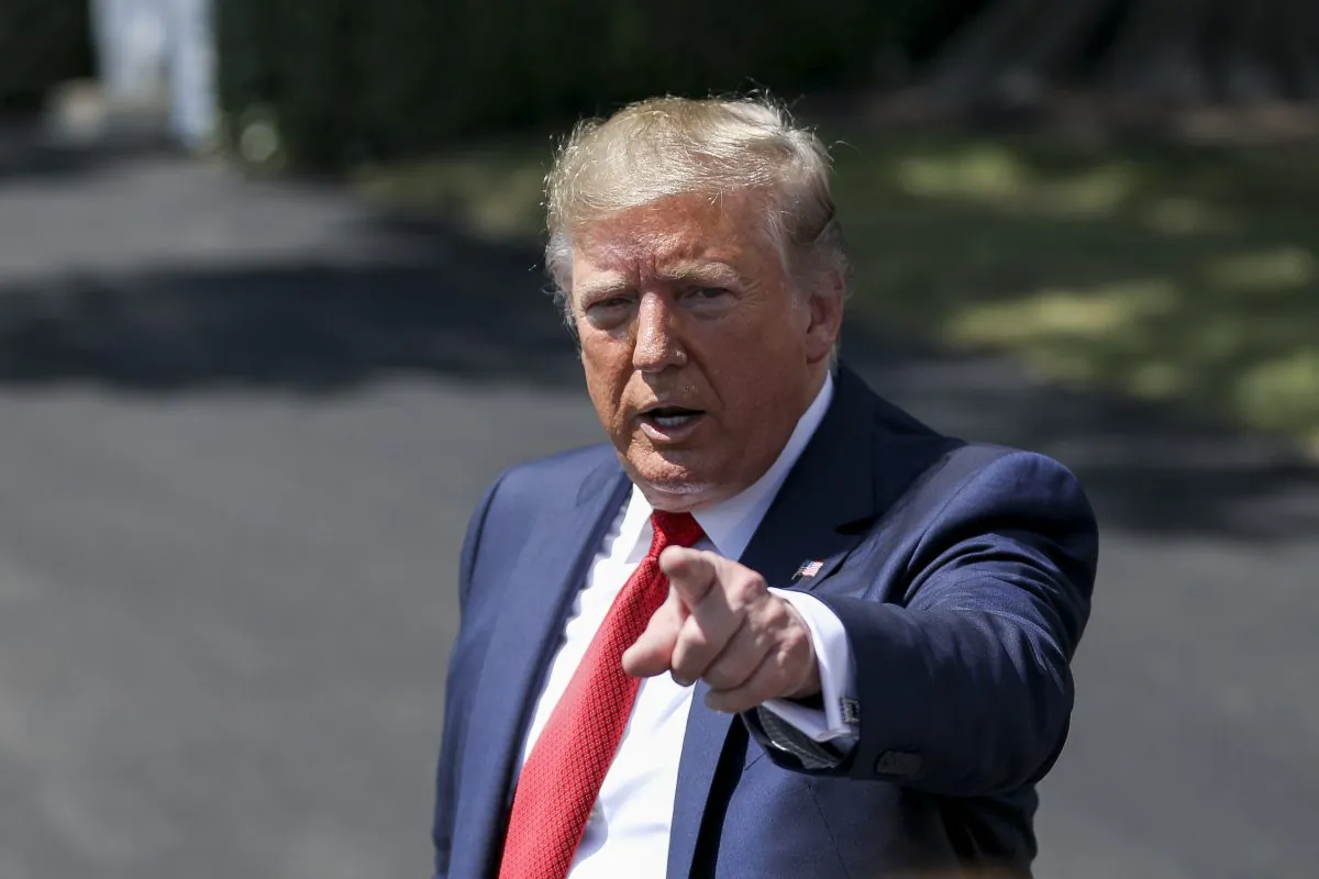 President Donald Trump speaks to media before departing the White House on Marine One en route to Kentucky to speak at the American Veterans 75th National Convention, in Washington in Aug. 21, 2019. (Charlotte Cuthbertson/The Epoch Times)