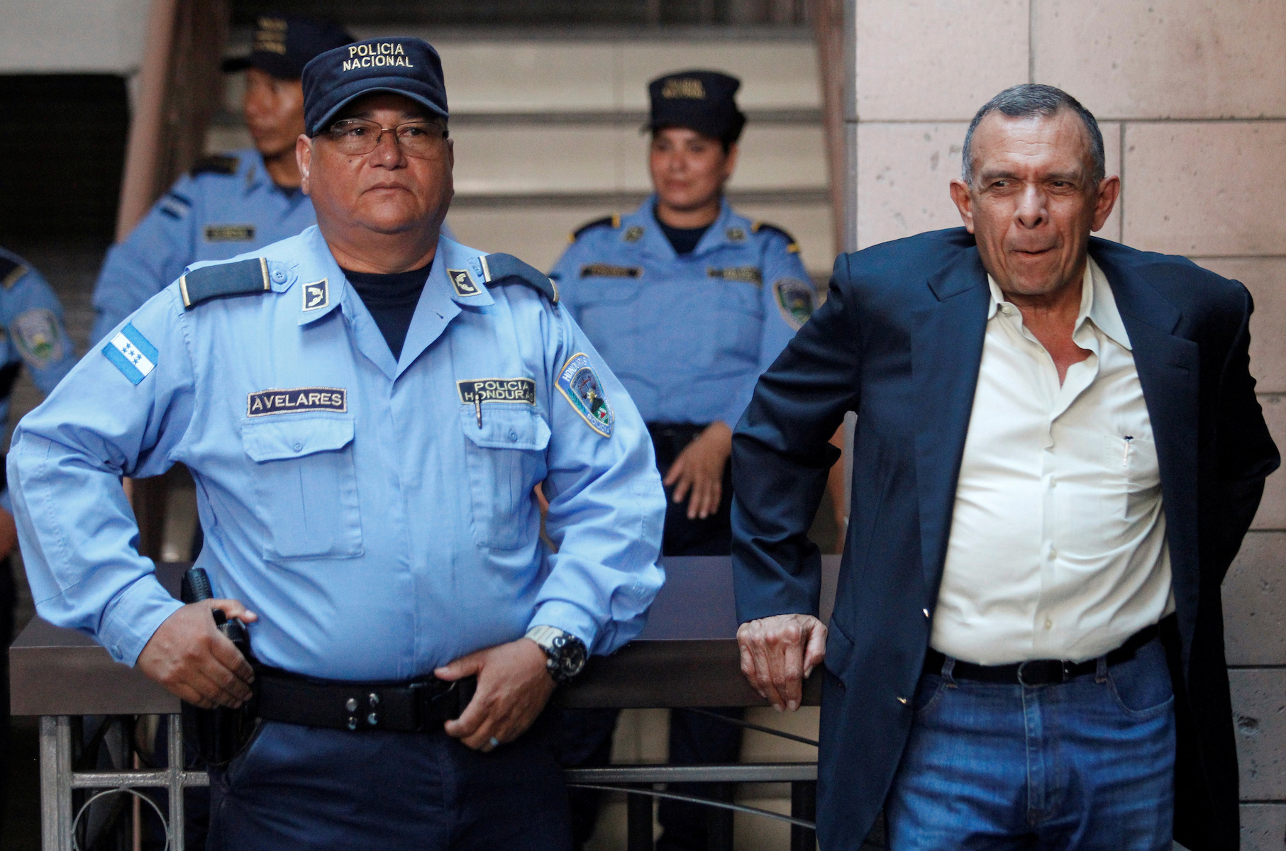 Former Honduras' President Porfirio Lobo waits outside a court where his wife Rosa Elena Bonilla is appearing to face graft charges, in Tegucigalpa