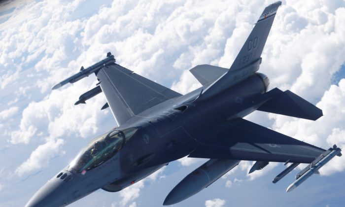 A U.S. Air Force F-16 fighter taking part in the U.S.-led Saber Strike exercise flies over Estonia on June 6, 2018. (Ints Kalnins/Reuters)