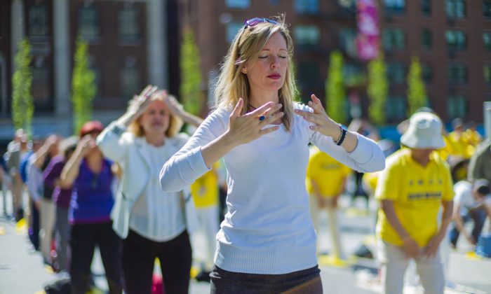 Falun Gong practitioners exercise at Union Square in New York as they celebrate World Falun Dafa Day on May 12, 2016. (The Epoch Times)