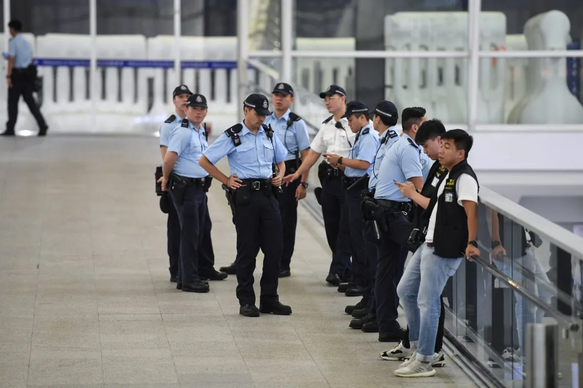 Policemen patrol inside the Hong Kong international airport on August 19, 2019. (GREG BAKER/AFP/Getty Images)