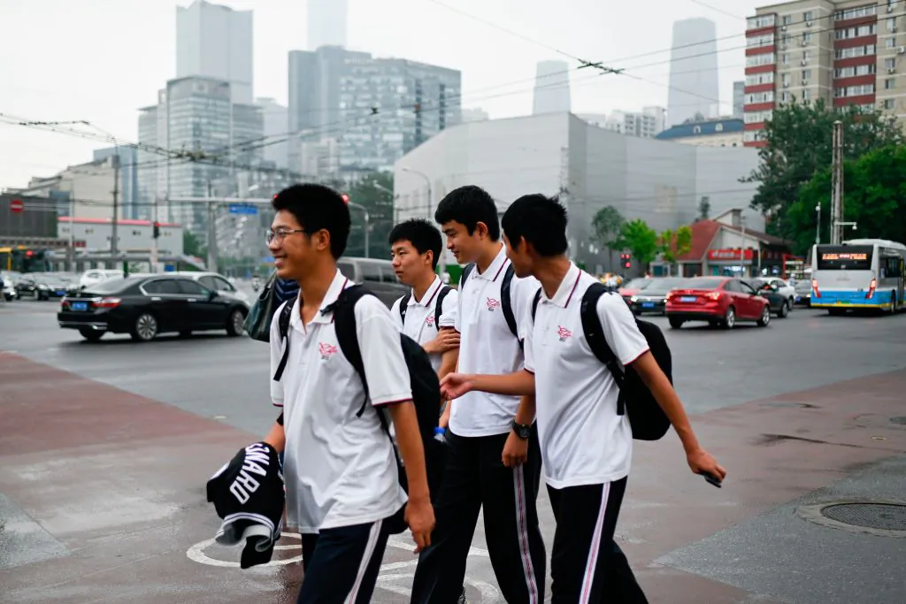 A group of students crosses a street in Beijing on June 6, 2019. (Wang Zhao/AFP/Getty Images)