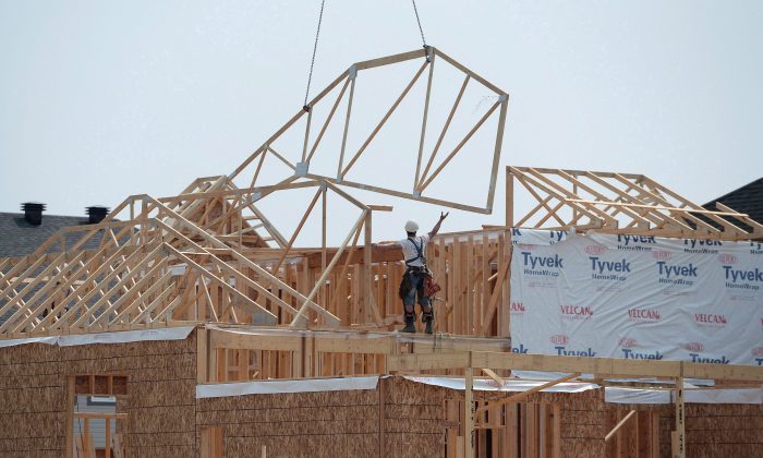 Construction workers build new homes in a development in Ottawa in this file photo. (The Canadian Press/Sean Kilpatrick)