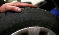 Car Mechanic Bounces Tires Like a Basketball