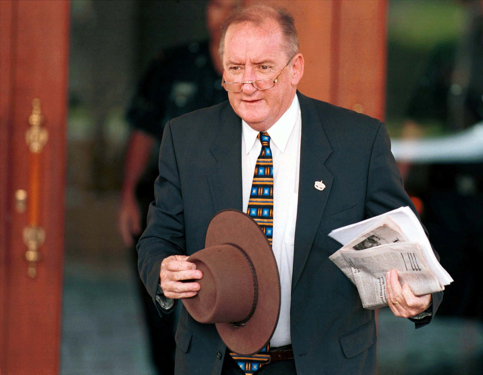 FILE PHOTO: Australian Trade Minister Tim Fischer arrives for the second day of the 10th Asia-Pacific Economic C..
