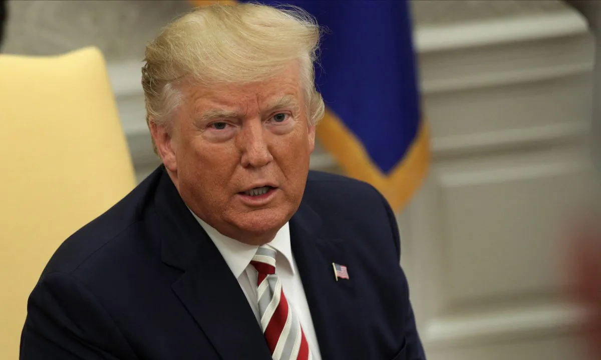 U.S. President Donald Trump speaks to members of the media as he meets with President of Romania Klaus Iohannis in the Oval Office of the White House on Aug. 20, 2019. (Alex Wong/Getty Images)