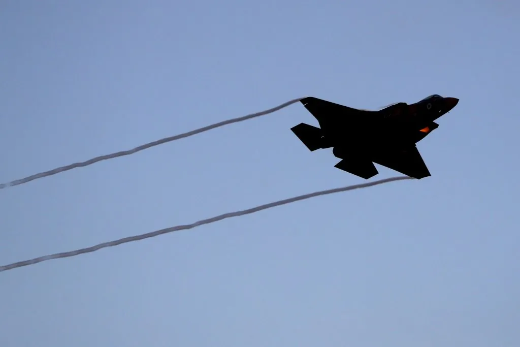 An Israeli fighter jet performs during an air show at the graduation ceremony of Israeli pilots in the Hatzerim Israeli Air Force base in the Negev desert, near the southern Israeli city of Beer Sheva, on June 27, 2019. (JACK GUEZ/AFP/Getty Images)