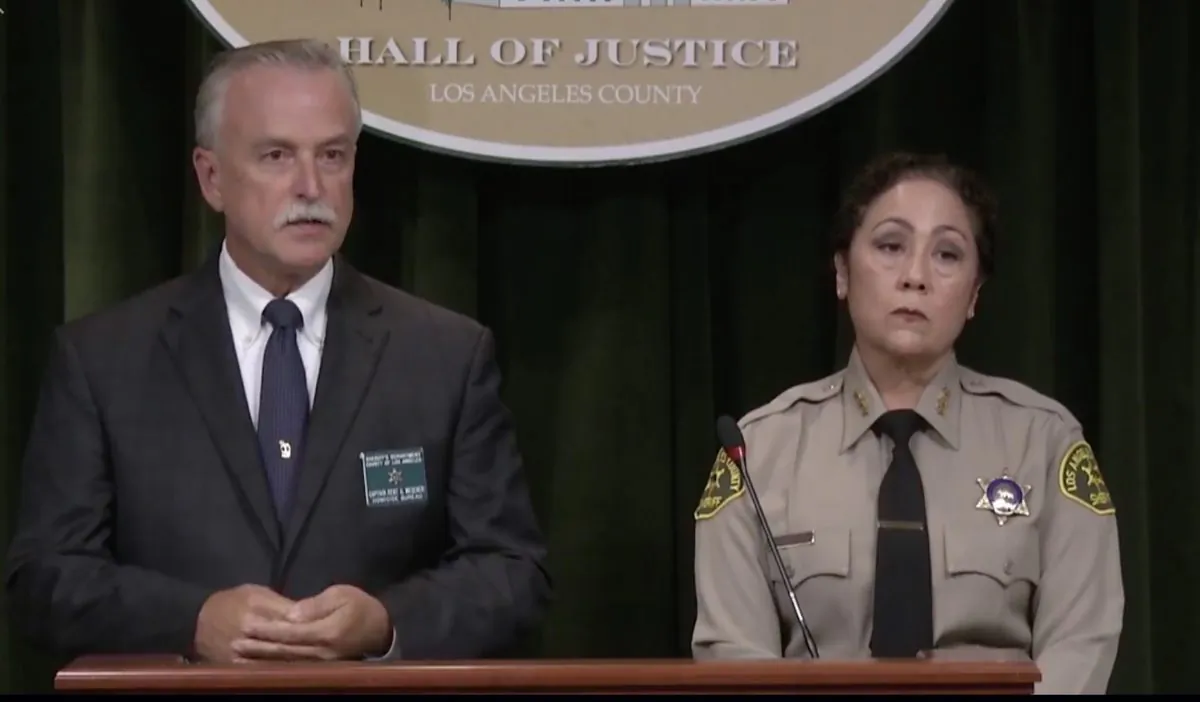 Capt. Kent Wegener (L) and Asst. Sheriff Sheriff Robin Limon said at a press conference of Aug. 24, 2019, that deputy Angel Reinosa admitted to fabricating the sniper shooting that resulted in a massive response earlier in the week. (Los Angeles County Sheriff's Department)