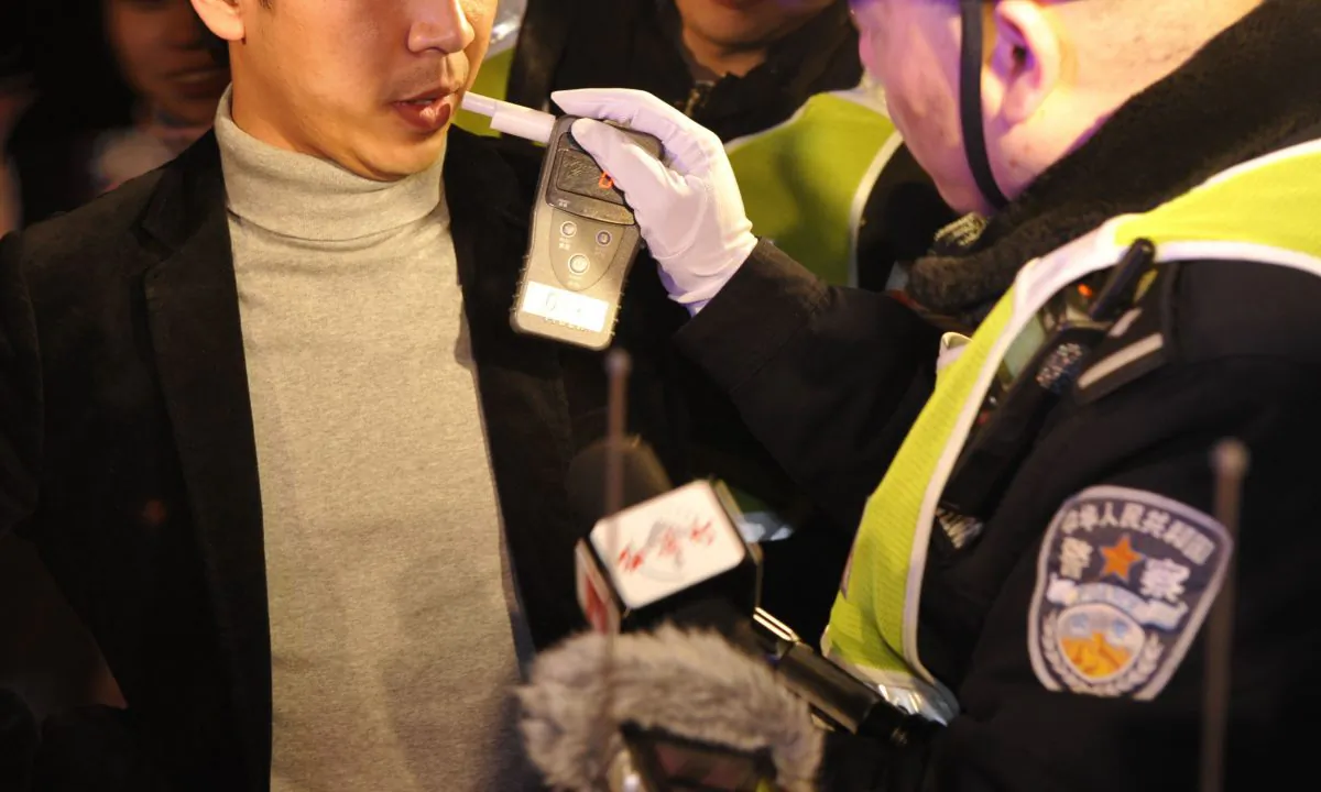 A man receiving a breathalyzer test in China. (STR/AFP/Getty Images)
