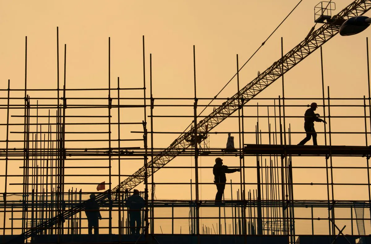 Workers are seen on scaffolding at a construction site in Nantong, Jiangsu Province, China on Jan. 1, 2019. (Reuters)