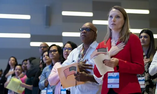 Heckled When She Spoke Out for Pledge of Allegiance, Academic Sues