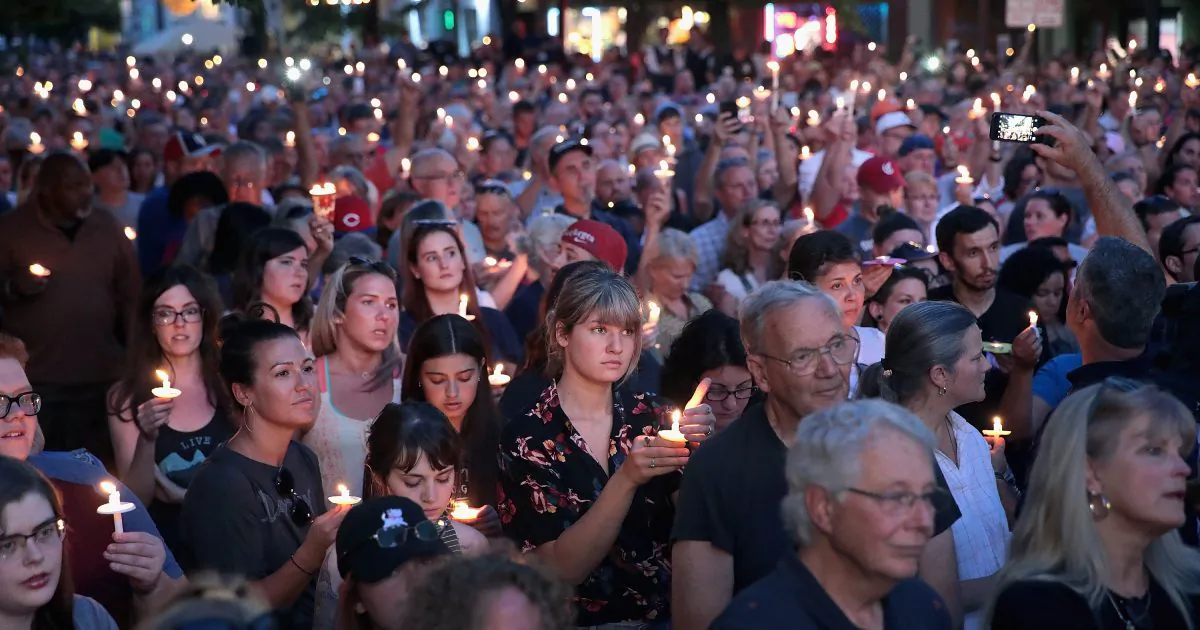 Mourners attend a memorial service in the Oregon District to recognize the victims of an early-morning mass shooting in the popular nightspot on Aug. 04, 2019 in Dayton, Ohio. (Scott Olson/Getty Images)
