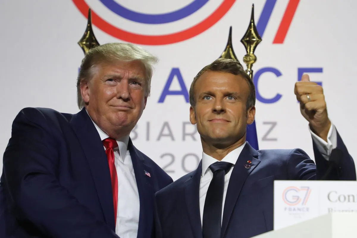 France's President Emmanuel Macron (R) and U.S. President Donald Trump shake hands during a joint-press conference in Biarritz, France, on Aug. 26, 2019. (Ludovic Marin/AFP/Getty Images)