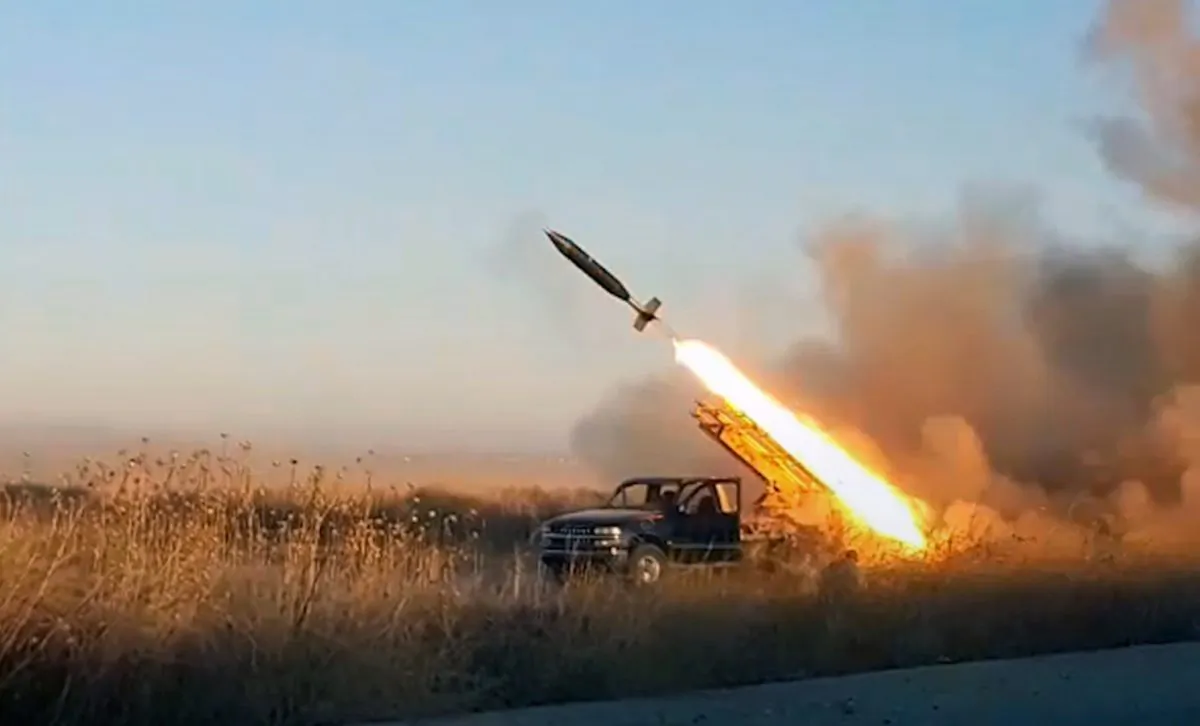 A missile fired by the al-Qaeda-linked Hayat Tahrir al-Sham militant group against Syrian government forces position in Idlib Province, Syria, on Aug. 27, 2019. (Ibaa News Agency via AP)