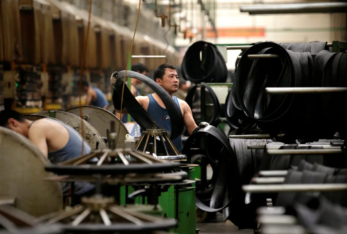 An employee works on the production line of a tire factory under Tianjin Wanda Tire Group, which exports its products to countries such as U.S. and Japan, in Xingtai, Hebei Province, China on May 21, 2019. (Jason Lee/Reuters)