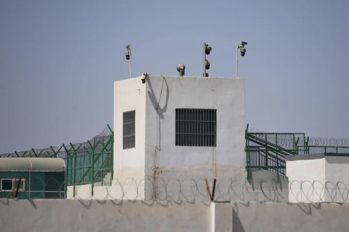 The outer wall of a believed re-education camp is equipped with several surveillance cameras in China's northwestern Xinjiang region on May 31, 2019. (GREG BAKER/AFP/Getty Images)