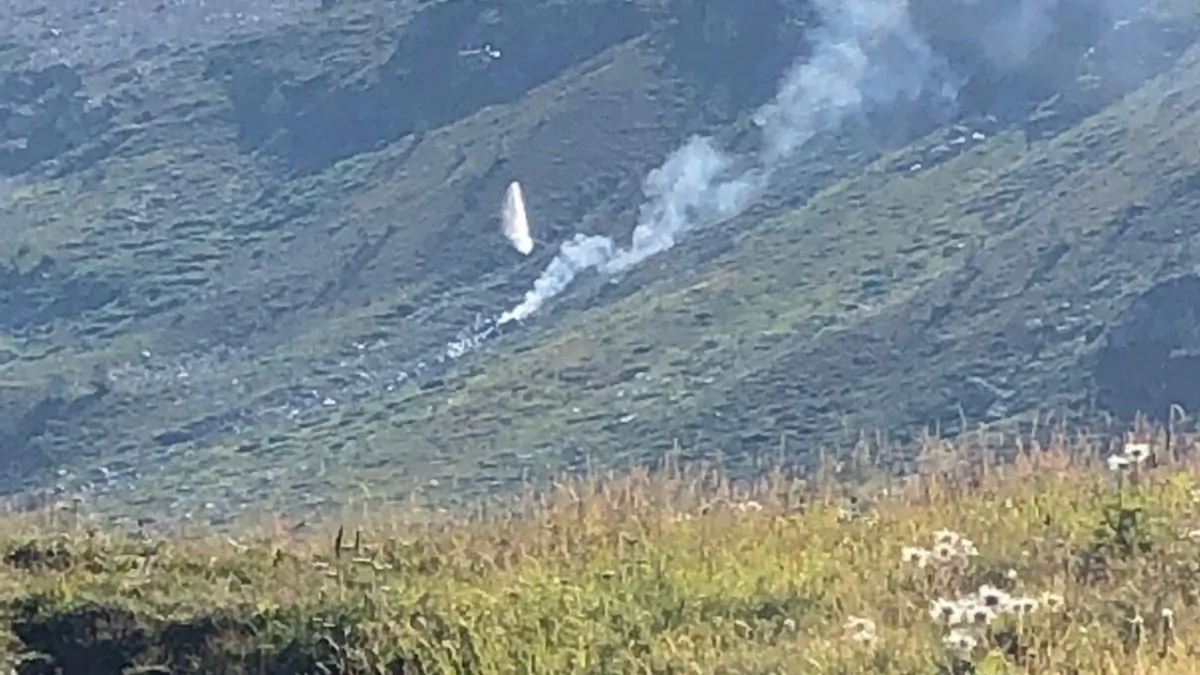 Smoke is seen at the site of a plane crash at the Simplon Pass in Switzerland, in this picture released by Police Cantonale du Valais on AuG. 25, 2019. (Police Cantonale du Valais/Handout via reuters)