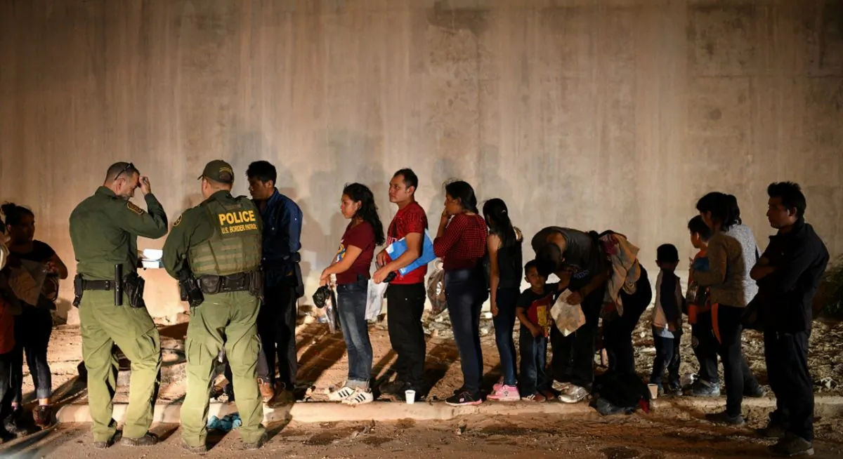 Illegal immigrant families turn themselves in to U.S. Border Patrol to seek asylum following an illegal crossing of the Rio Grande in Hidalgo, Texas, on Aug. 23, 2019. (Loren Elliott/Reuters)