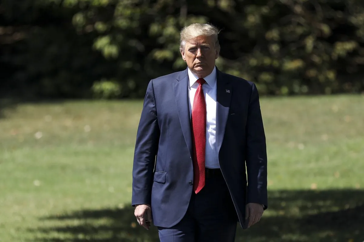 President Donald Trump walks toward the media before departing the White House on Marine One en route to Kentucky to speak at the American Veterans 75th National Convention, in Washington in Aug. 21, 2019. (Charlotte Cuthbertson/The Epoch Times)