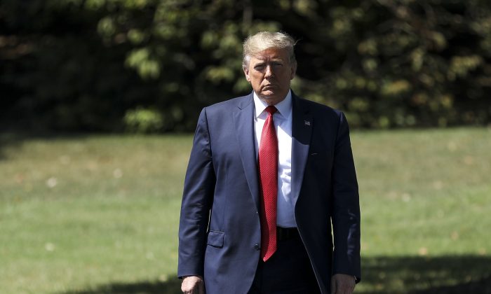 President Donald Trump walks toward the media before departing the White House on Marine One en route to Kentucky to speak at the American Veterans 75th National Convention, in Washington in Aug. 21, 2019. (Charlotte Cuthbertson/The Epoch Times)