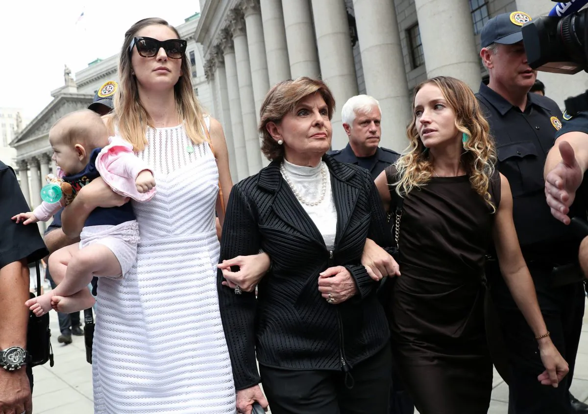 Gloria Allred (C), representing alleged victims of Jeffrey Epstein, leaves with Teala Davies and an unidentified women and baby after the hearing in the criminal case against Epstein, who died this month in what a New York City medical examiner ruled a suicide, at Federal Court in New York, on Aug. 27, 2019. (Shannon Stapleton/Reuters)