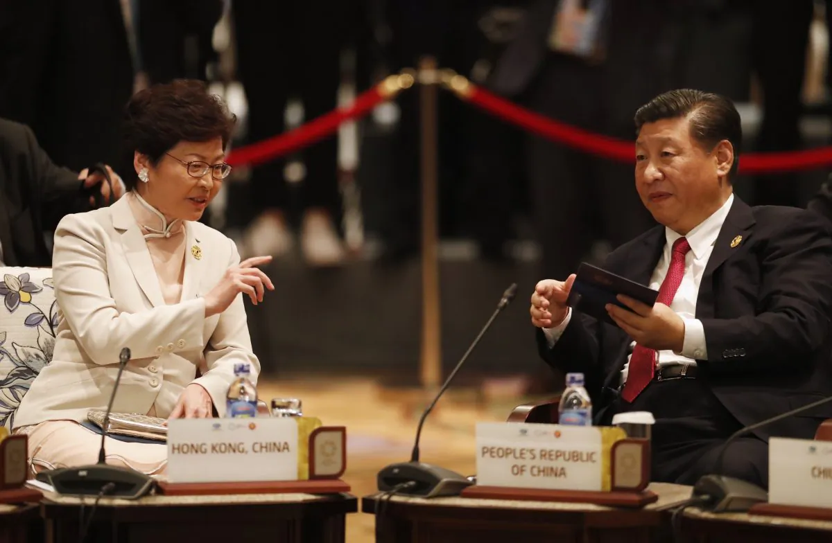 Chinese leader Xi Jinping and Hong Kong's Chief Executive Carrie Lam (L) talk during the Asia-Pacific Economic Cooperation leaders' summit in Danang, central Vietnam, on Nov. 10, 2017. (JORGE SILVA/AFP/Getty Images)