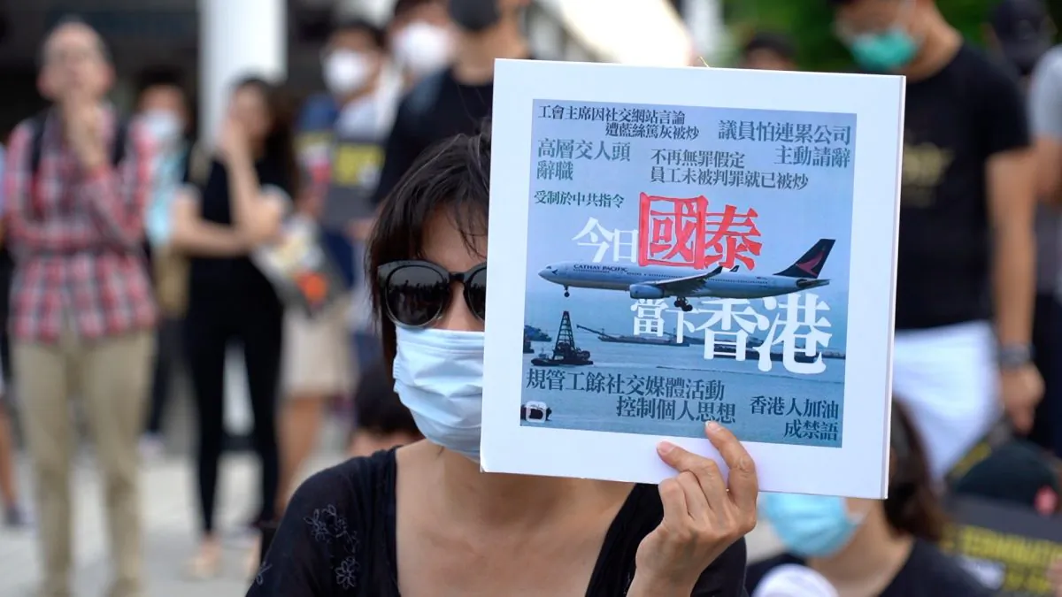 A rally was held in Hong Kong protesting Cathay Pacific's recent firings of staff over supporting protests. A large banner that read "Revoke Termination Stop Terrorizing CX Staff was on stage in Edinburgh Place, Hong Kong on Aug. 28, 2019. (Shenghua Sung/NTD News)