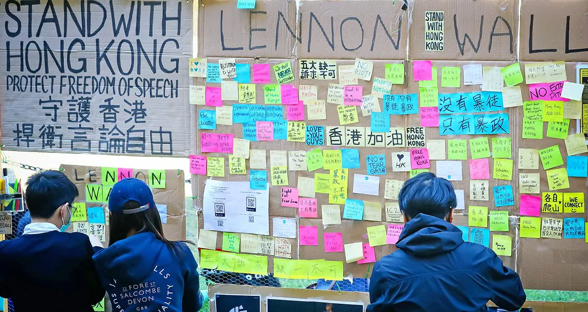 People post notes on a makeshift Lennon Wall to support the Hong Kong democracy movement at the University of Queensland in Brisbane, Australia, on Aug. 9, 2019. (Patrick Hamilton/AFP/Getty Images)