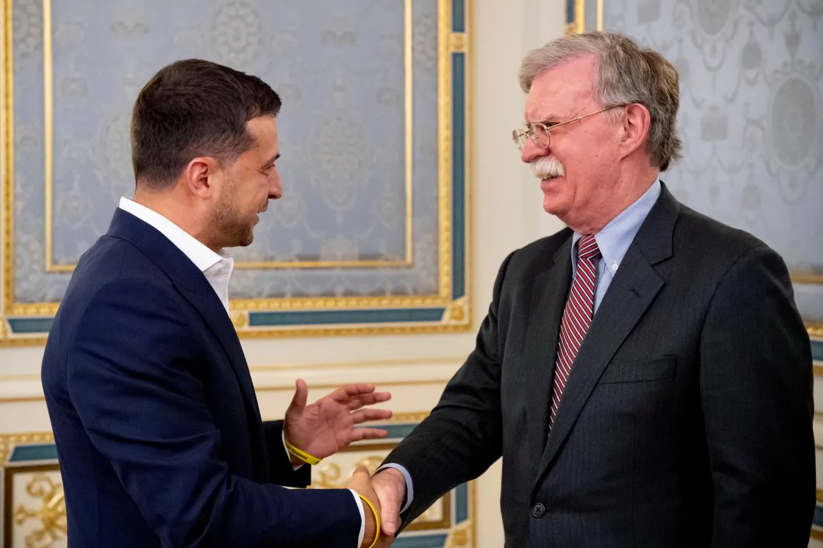 Ukrainian President Volodymyr Zelenskiy shakes hands with U.S. National Security Advisor John Bolton during a meeting in Kiev, Ukraine on Aug. 28, 2019. (Ukrainian Presidential Press Service/Handout via Reuters)