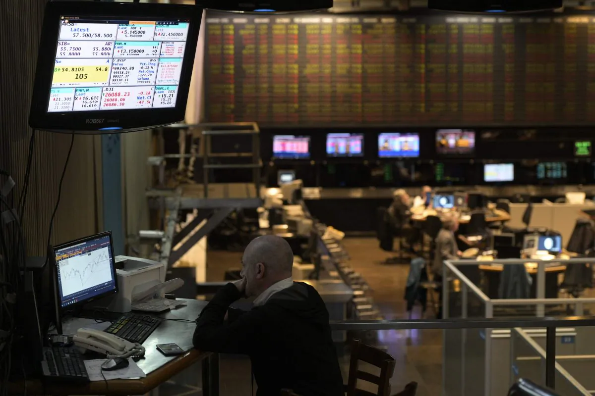 A broker looks at a screen at the Buenos Aires Stock Exchange in the financial district of Buenos Aires on Aug. 20, 2019 after Argentina's President Mauricio Macri swore Hernan Lacunza in as the country's new economy minister. Lacunza made stabilizing the country's battered currency his top priority, while still pledging to meet commitments made to the IMF. (Juan Mabromata/AFP/Getty Images)