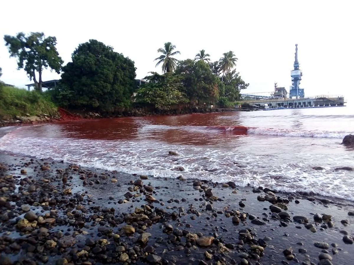 Waste from a nickel plant in Papua New Guinea owned by Metallurgical Corporation of China is seen in the waters of the adjacent Basamuk Bay, according to Reuters sources, in Basamuk, Mandang, Papua New Guinea on Aug. 24, 2019 in this picture obtained from social media. (Nigel Uyam/via Reuters)